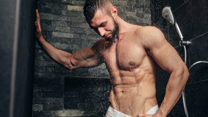 latin muscular man showering