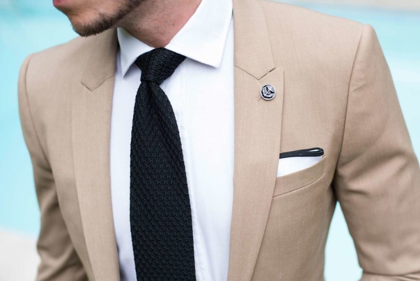 khaki suit black tie